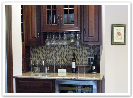 Built-in bar area with glass doors