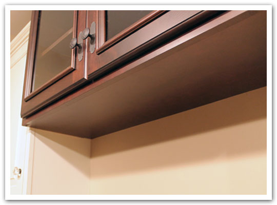 Upper cabinetry has finished bottoms
